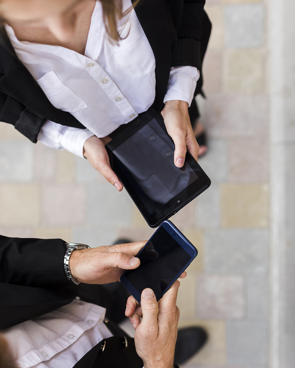 top-view-man-woman-with-devices copy